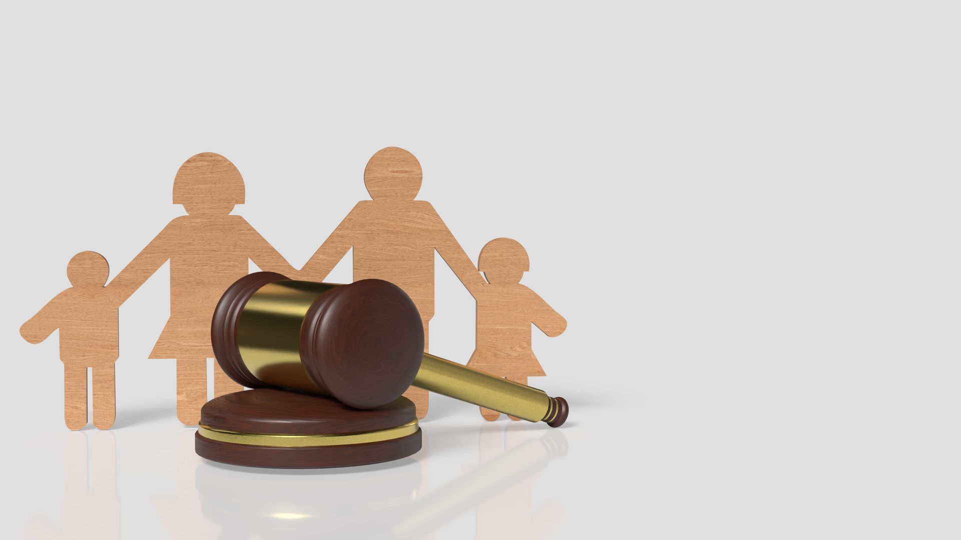 Wooden gavel and family figures, symbolizing legal family rights.