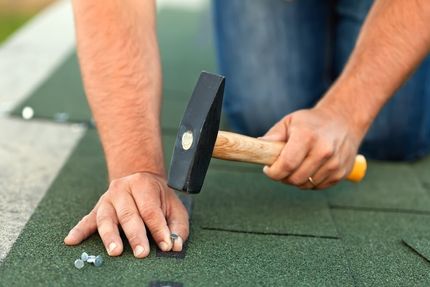 Man Installing Shingles — Jamestown, NY — Nelson John C Vinyl Siding & Roofing Corp