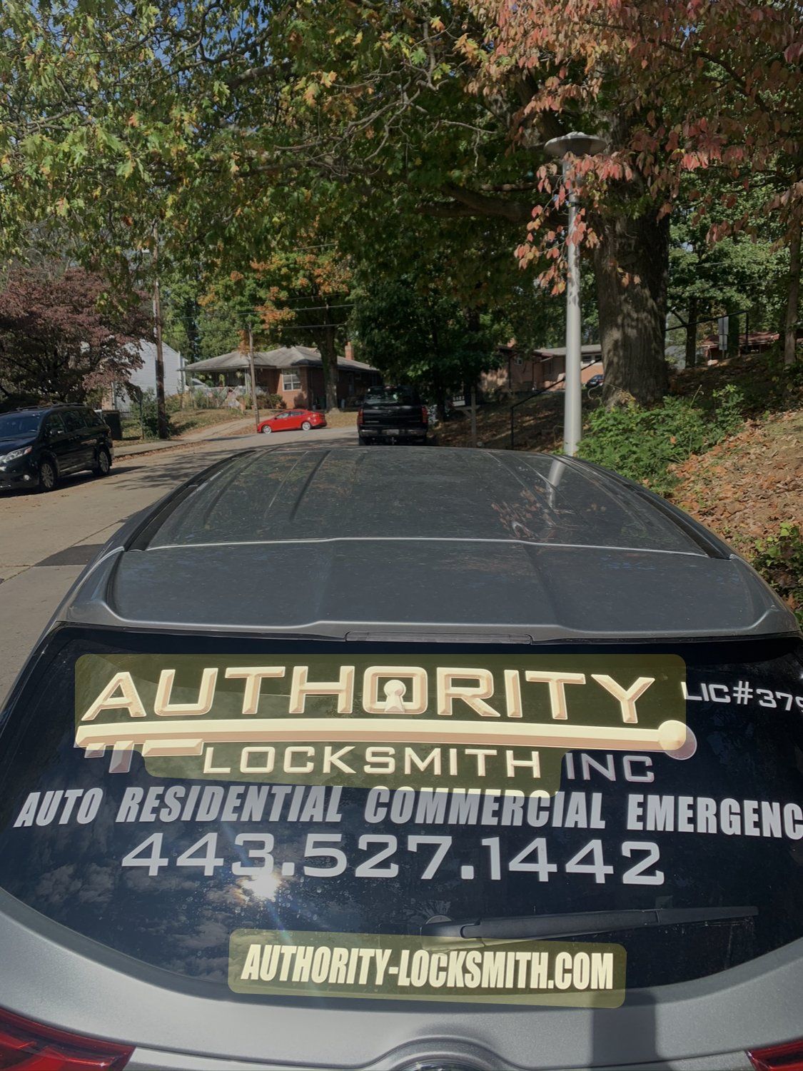 Authority Locksmith Inc car parked on a Baltimore street