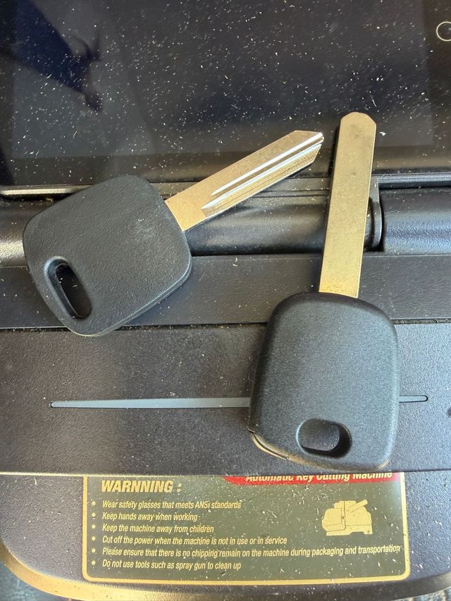 Two new chip keys cut on the key cutting machine