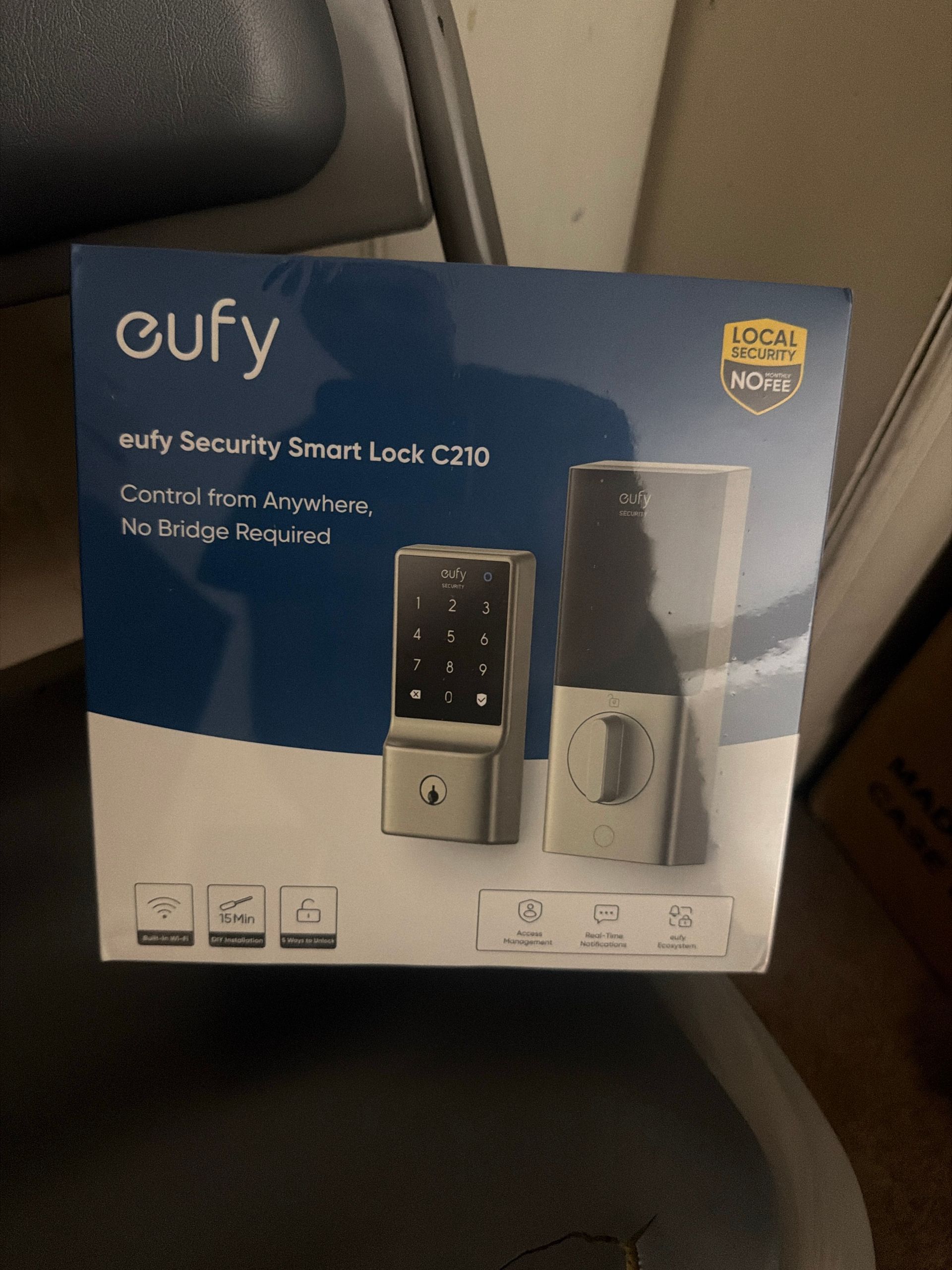 New keypad deadbolt still in its box, ready to install