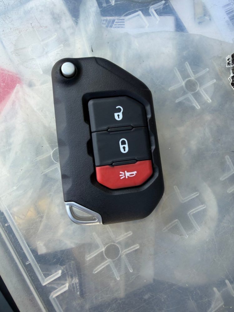 Jeep flip key with lock, unlock and panic buttons, close up