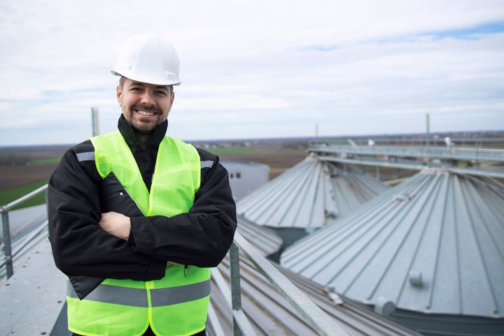 Building inspector assesses slate roof condition