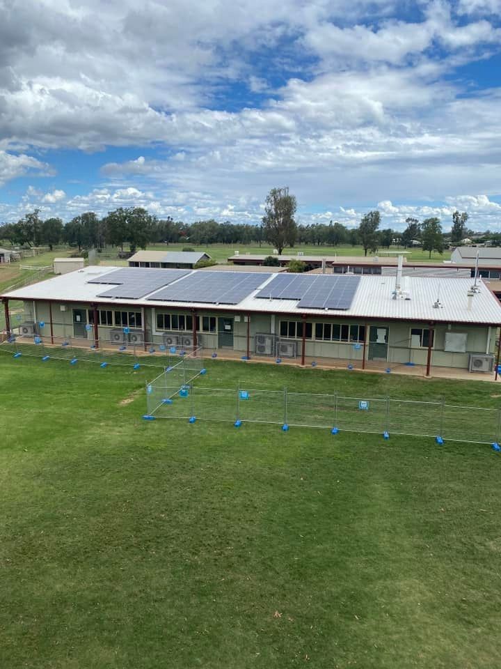 An Aerial View Of A Building With Solar Panels On The Roof — Evolution Solar Kingaroy in Kingaroy, QLD