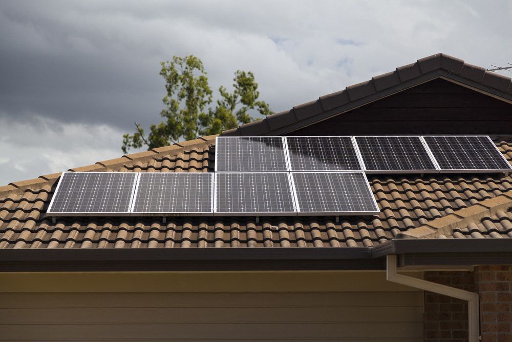 A Row Of Solar Panels On The Roof Of A House — Evolution Solar Kingaroy in Nanango, QLD