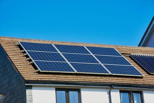 There Are Many Solar Panels On The Roof Of A House — Evolution Solar Kingaroy in Kingaroy, QLD