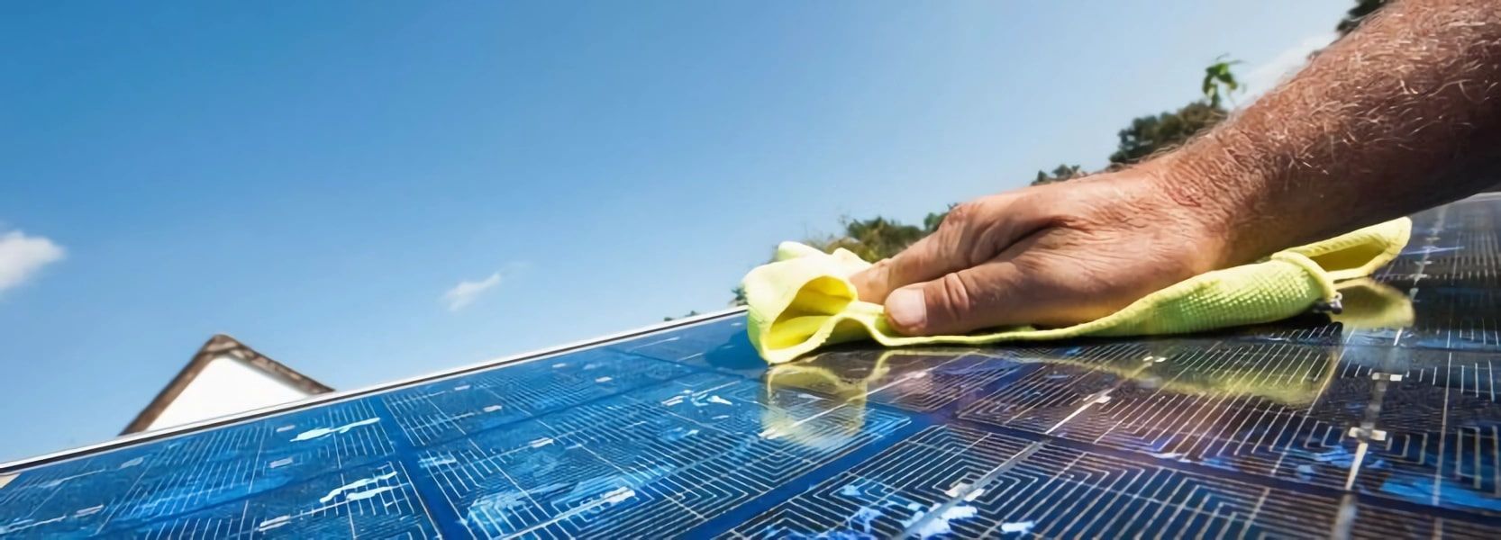 A Person Is Cleaning a Solar Panel with A Cloth — Evolution Solar Kingaroy in Kingaroy, QLD