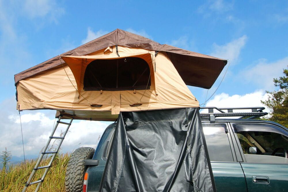 A Car With A Tent On Top Of It — Evolution Solar Kingaroy in Blackbutt, QLD