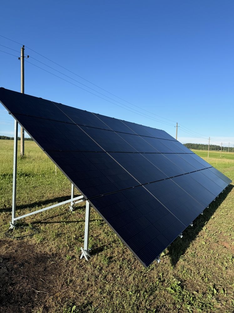 A Roof With Solar Panels On It And Trees In The Background — Evolution Solar Kingaroy in Kingaroy, QLD
