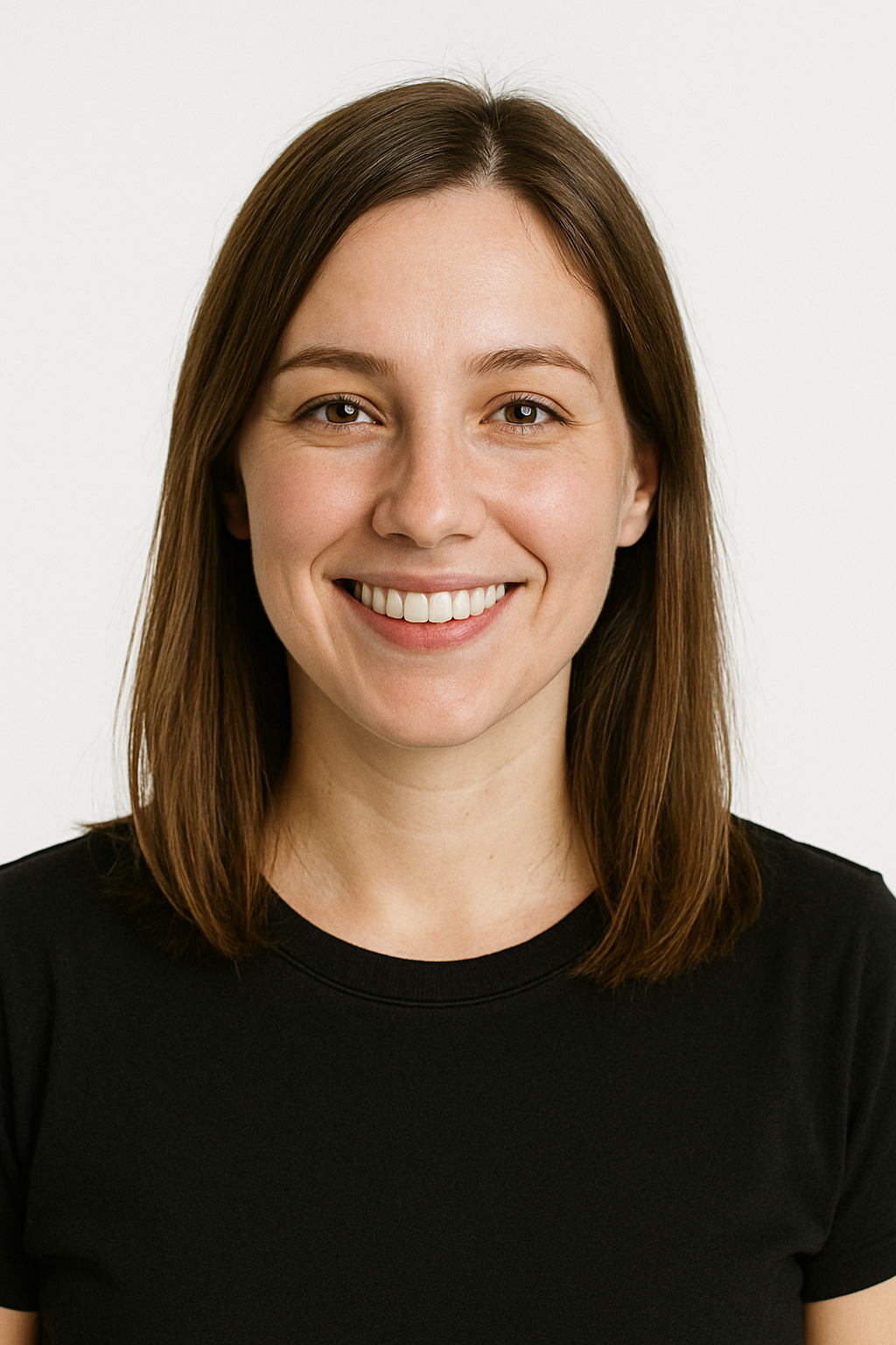 A woman in a black shirt is smiling for the camera.