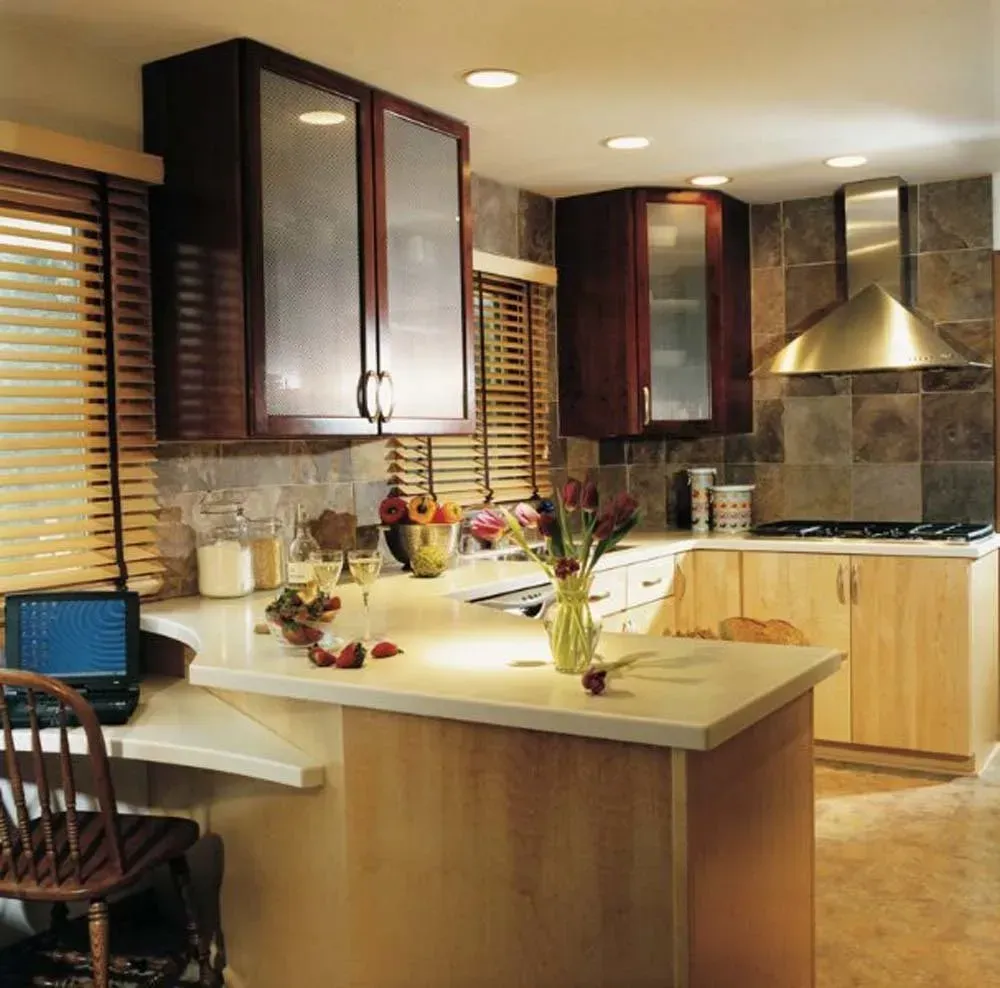 Modern kitchen with wooden cabinets, island counter, and stainless-steel range hood