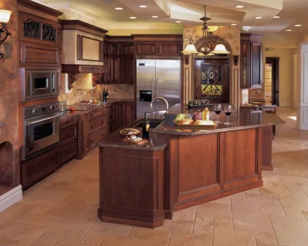 Spacious modern kitchen with dark wood cabinets, island, stainless steel appliances, and pendant lights