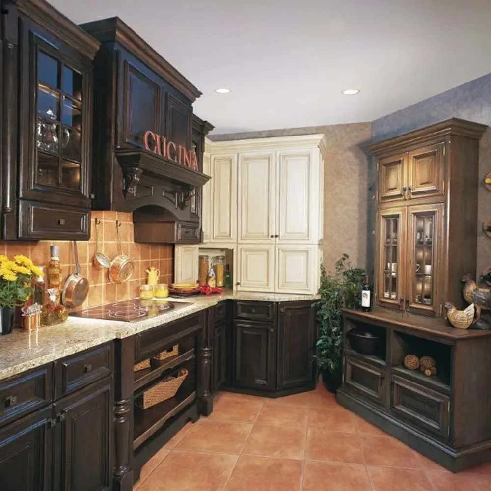 Dark wood kitchen with cream cabinets, granite counters, and terracotta tile floor