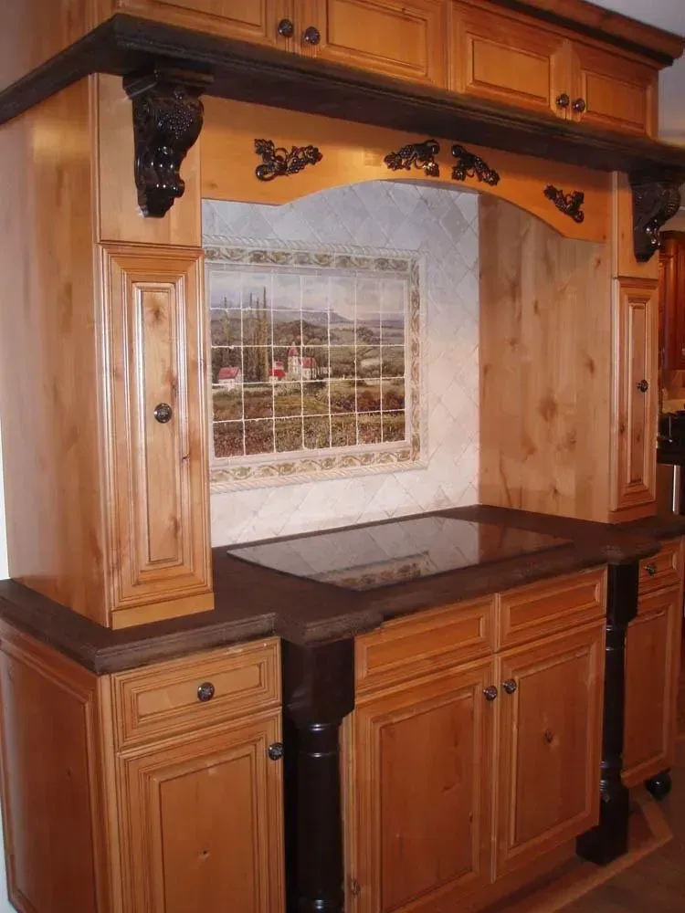 Wooden kitchen hutch with cabinets, dark countertop, and tiled backsplash in a rustic style