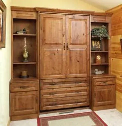 Wooden wall unit with cabinets, shelves, and drawers in a cozy paneled room
