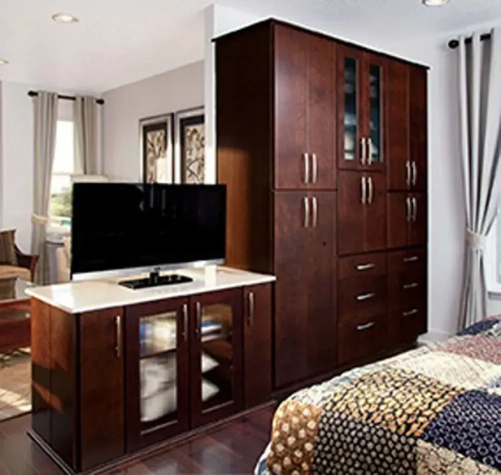Modern bedroom with dark wood wardrobe, TV cabinet, bed, and white curtains