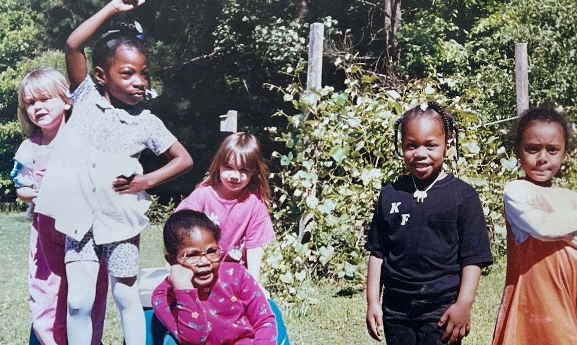 A group of children are posing for a picture together
