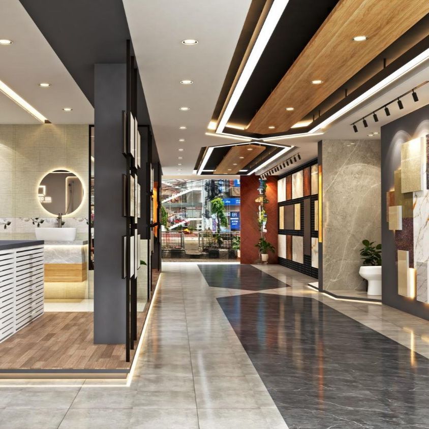 Interior of a tile showroom with displays and lighting. Marble floor, wood and dark accents.
