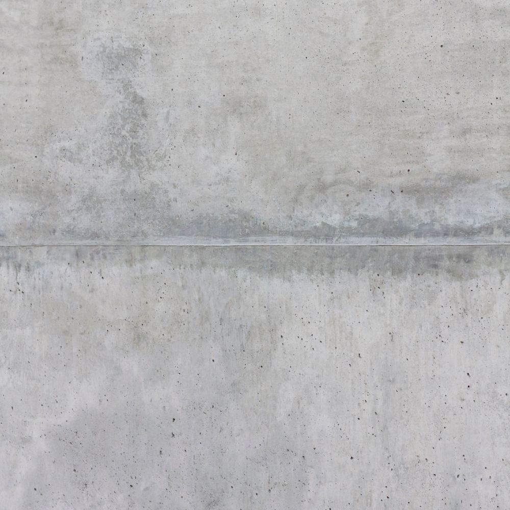 Gray concrete wall with a horizontal seam.