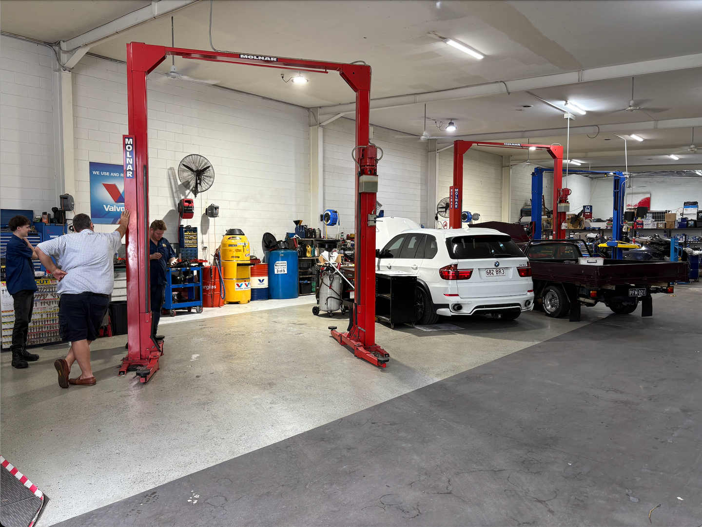 A Garage with Cars, People and Machinery — Monypenny Mechanical in Bungalow, QLD