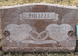 Polizzi family headstone featuring two hearts, interlocking rings, and dates in a cemetery setting.