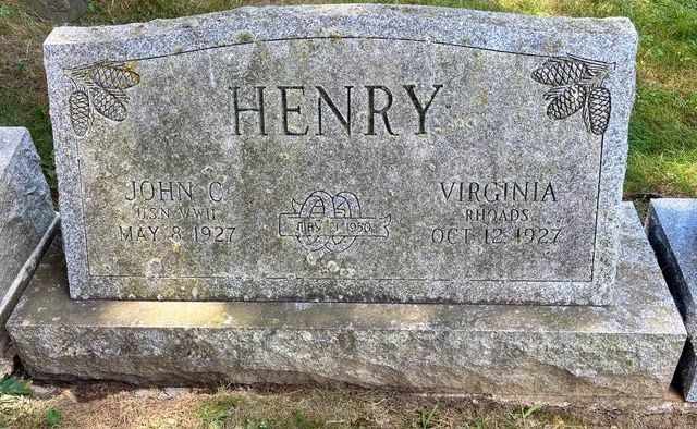 A gray granite headstone inscribed