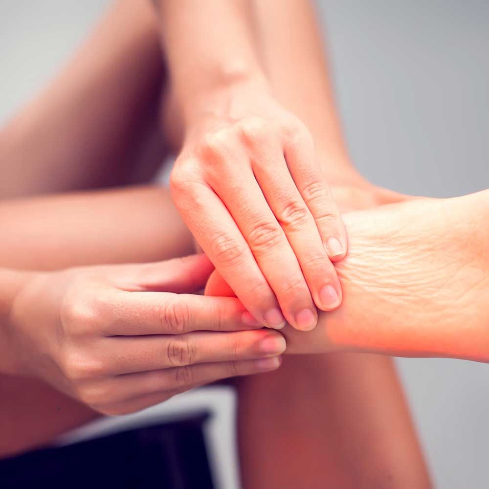 Woman experiencing heel pain in the Watertown, CT area