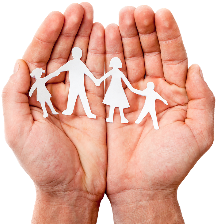 A person is holding a paper cut out of a family