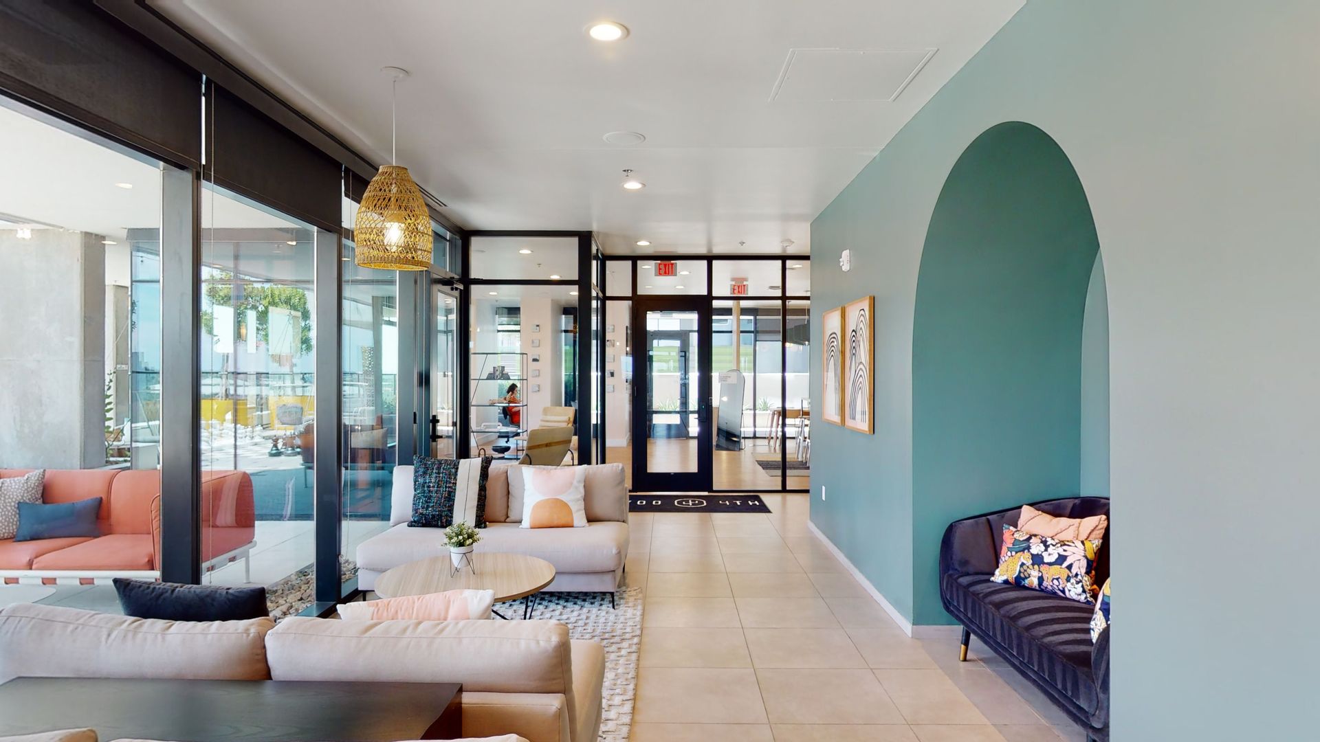 A living room with a lot of furniture and a blue wall.