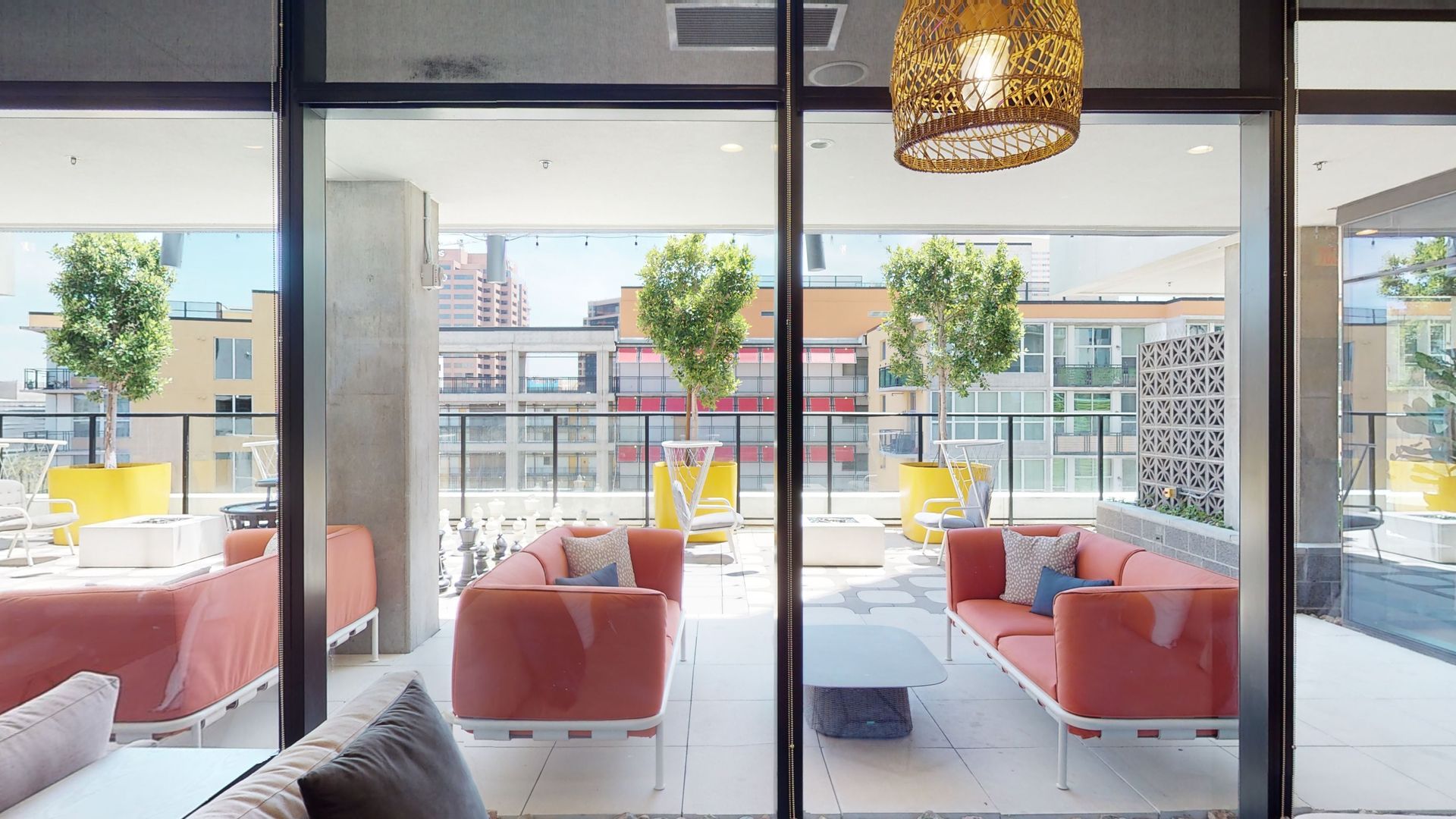 A living room with a lot of furniture and a sliding glass door.
