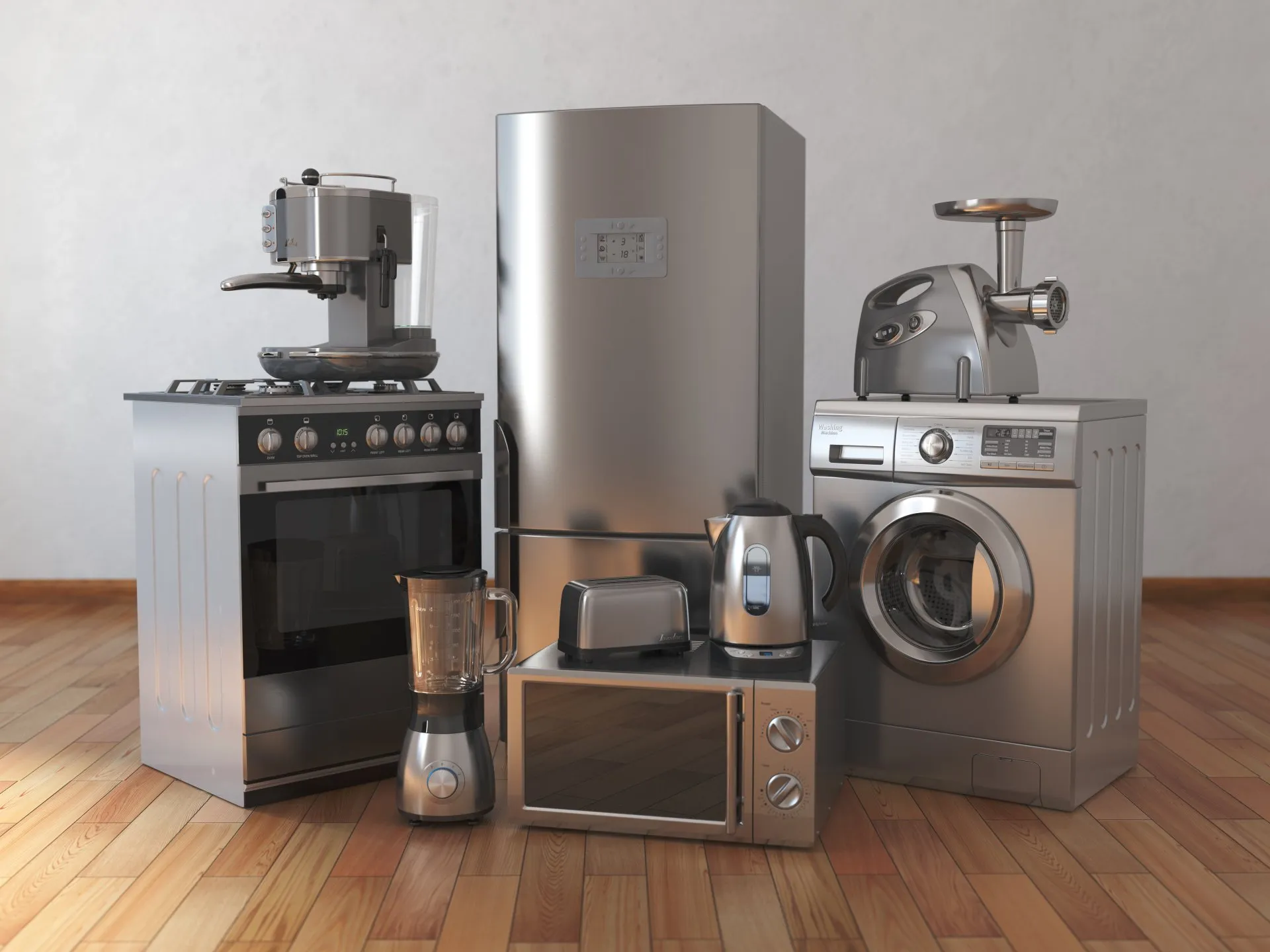 A group of stainless steel appliances are sitting on a wooden floor.