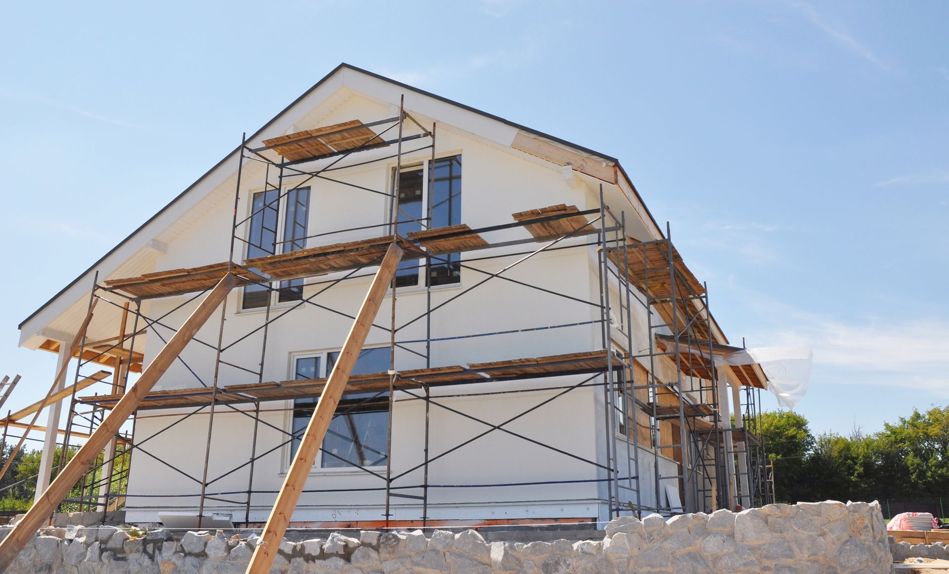 A house is being built with scaffolding around it.