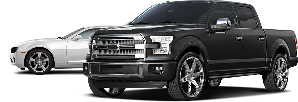 A black truck and a white car are parked next to each other | Greatway Tire and Auto Center