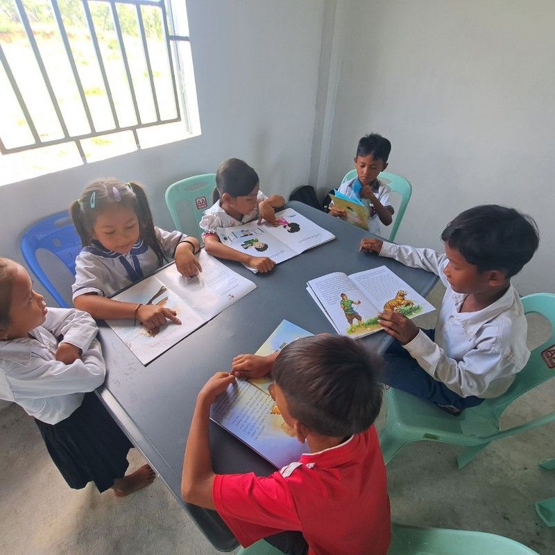 Children reading books in the library