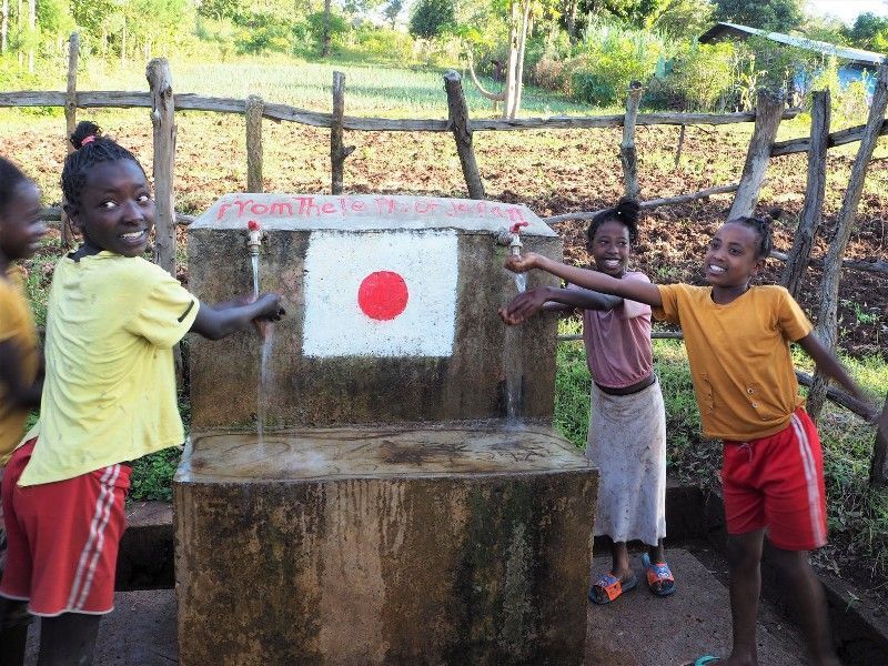 Children enjoying clean water at a water point