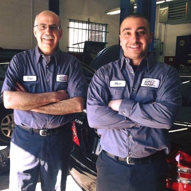 Two Friendly Auto Technicians Smiling Inside Workshop | East Rock Auto Repair