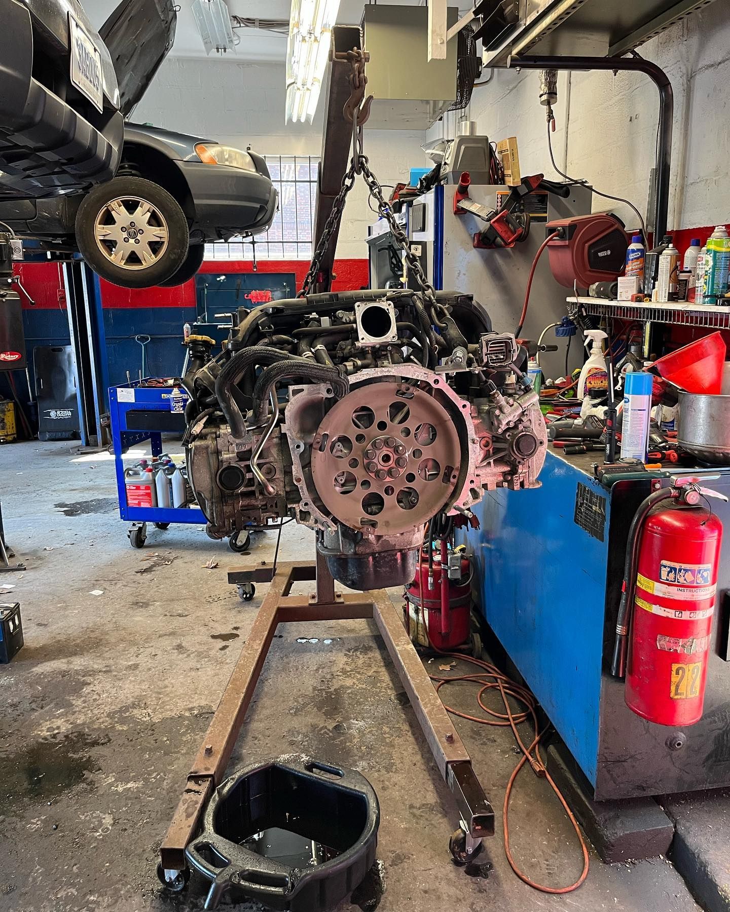 Engine Block Mounted On Red Stand During Vehicle Repair | East Rock Auto Repair