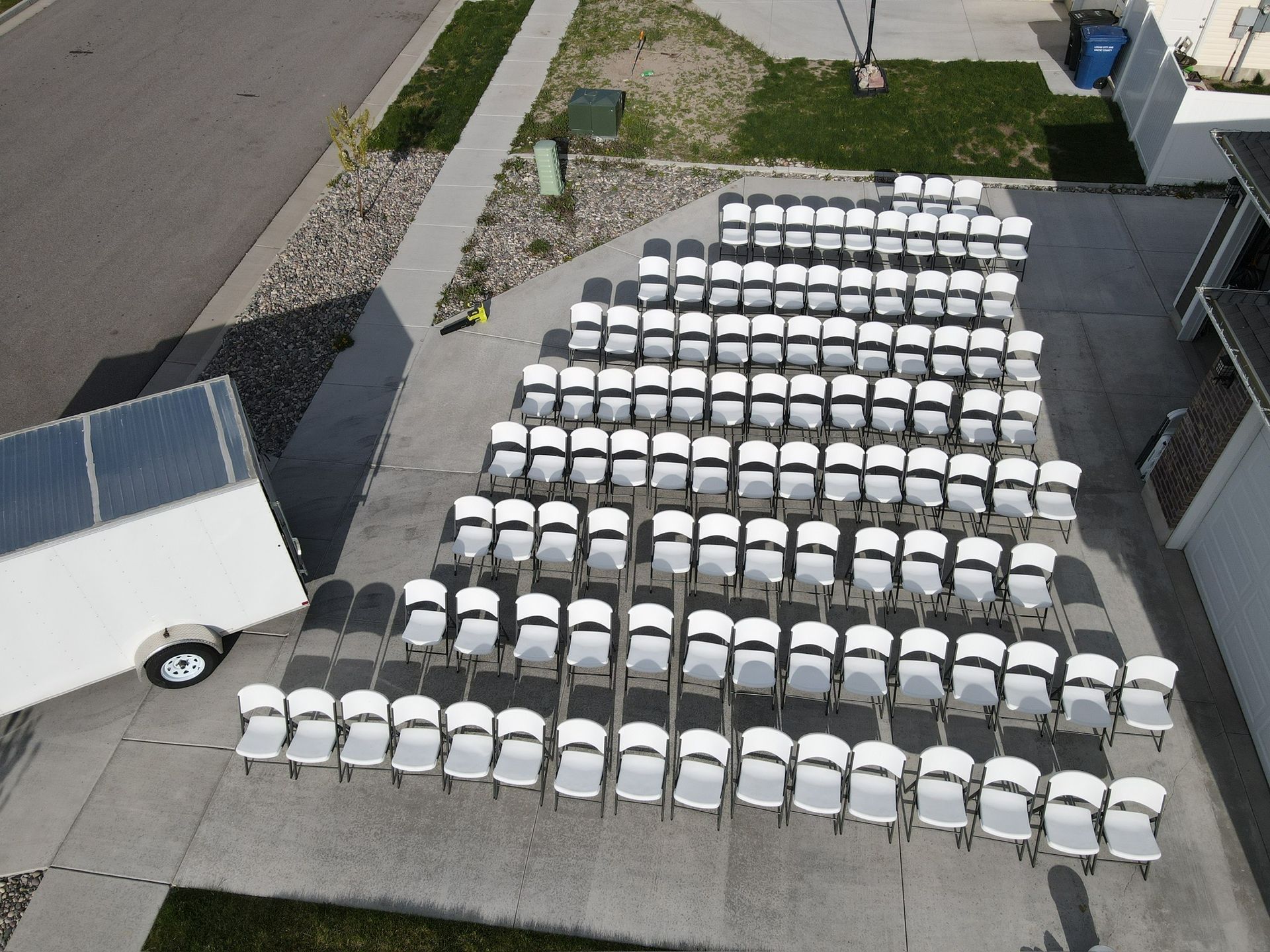Aerial view of chair rentals arranged for a large outdoor event in Logan Utah
