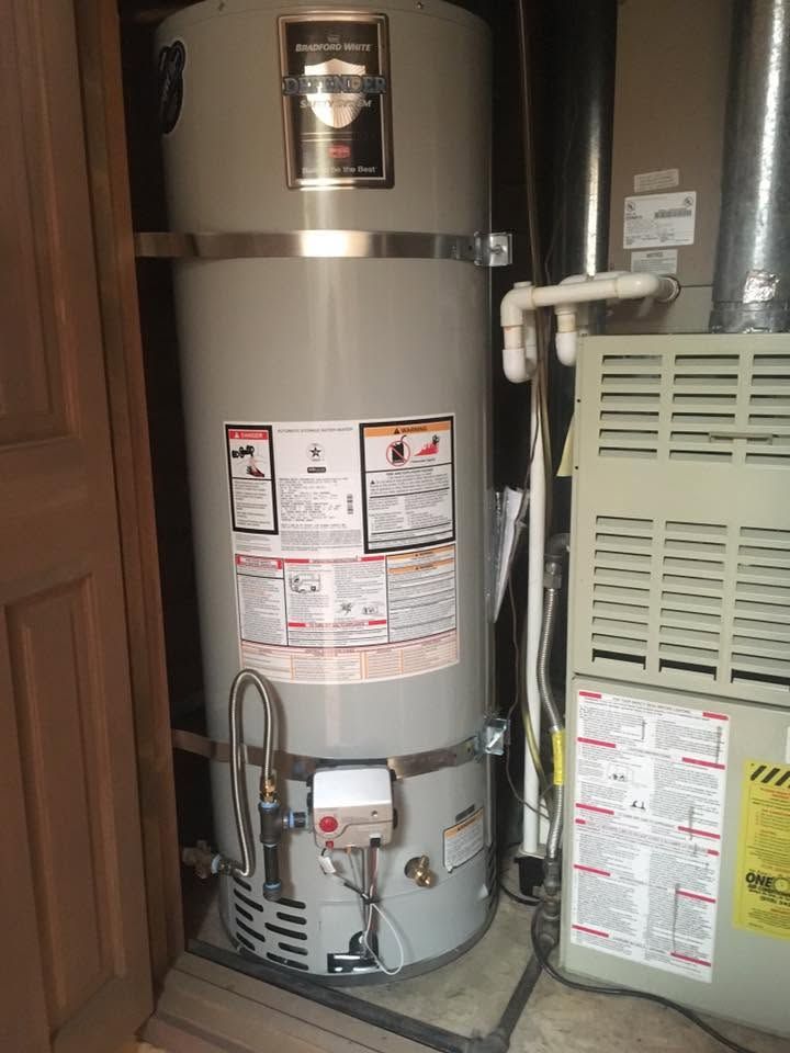 Water heater and furnace in a basement utility closet