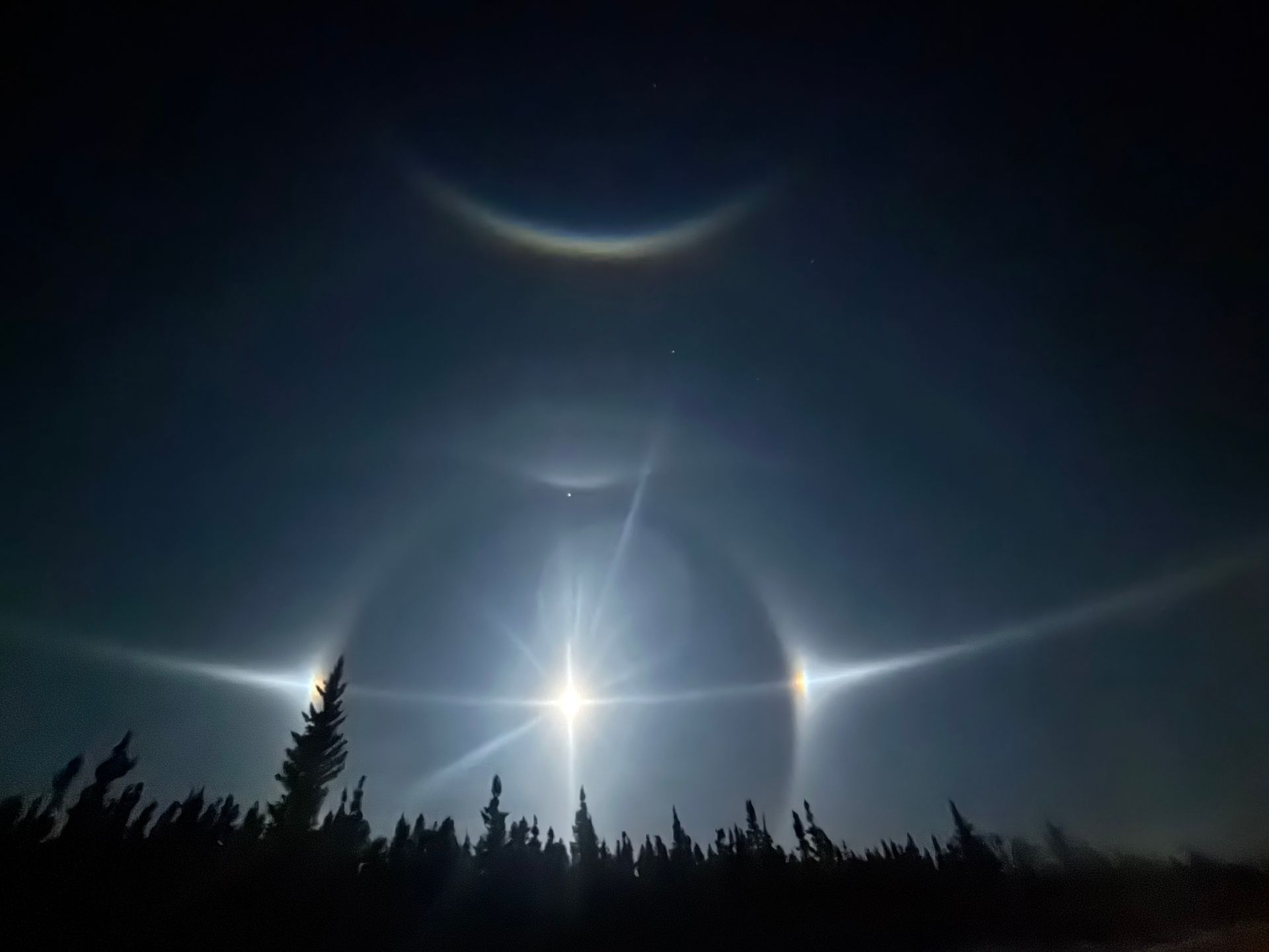 Ice fog creates moonbows near Tok, Alaska in the winter.