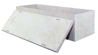 White concrete barrier blocks with a slanted front panel and rectangular back block