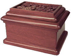 Wooden jewelry box with a carved lid, in dark reddish-brown wood