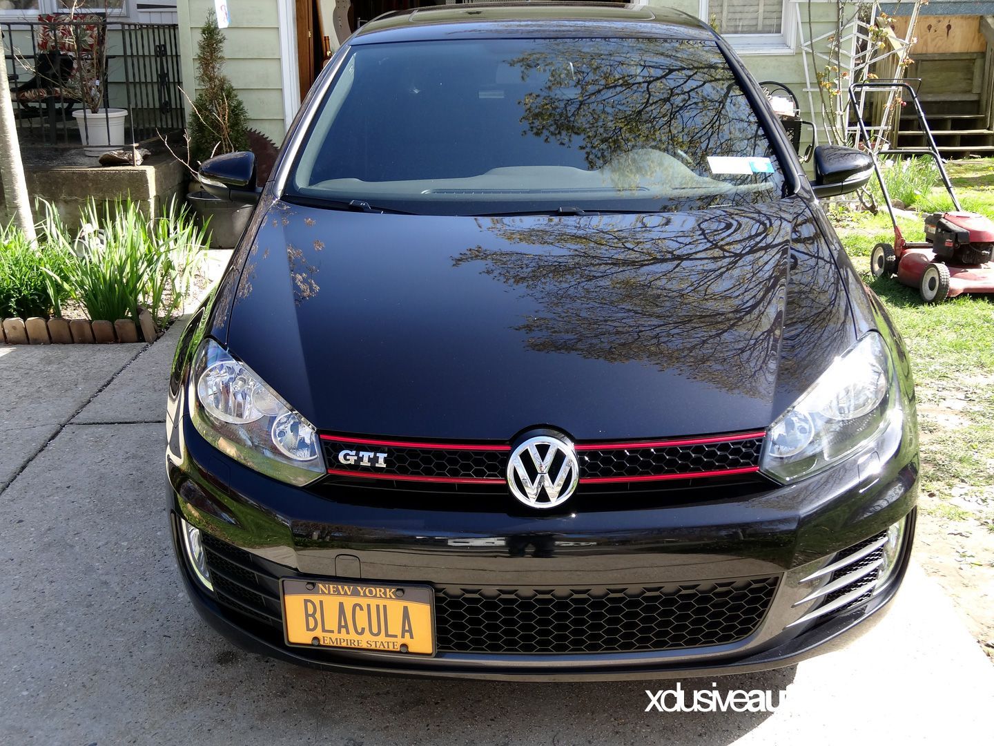 A black volkswagen with a new york license plate