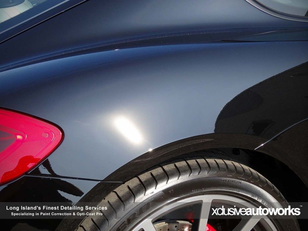 A close up of a car with the words xclusiveautoworks on it