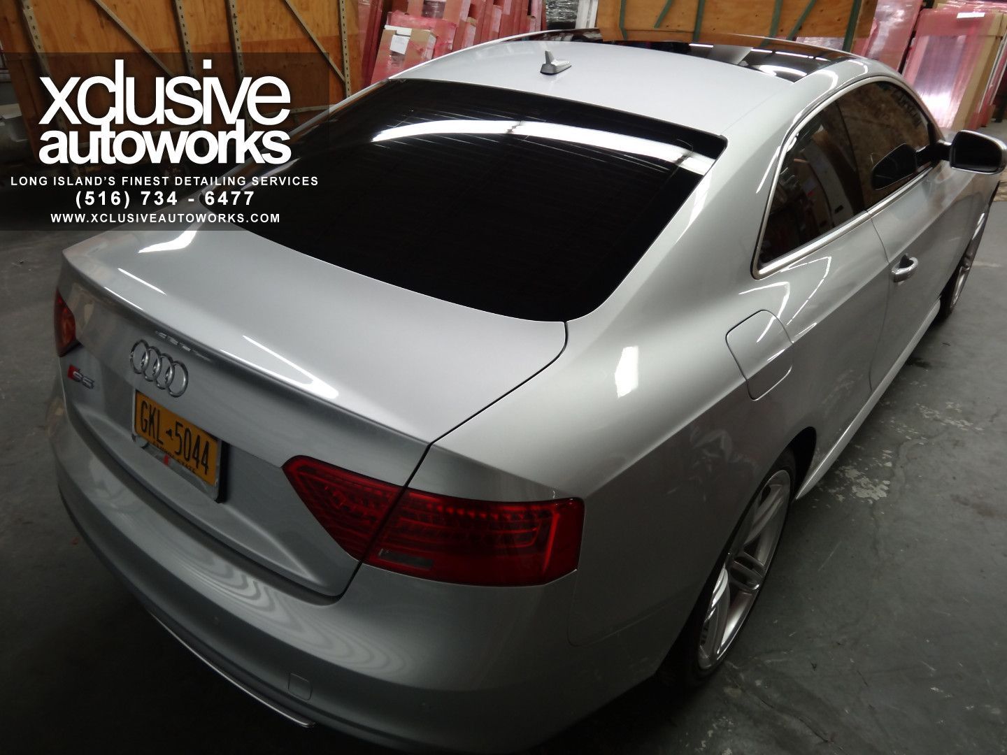 A silver audi with a new york license plate