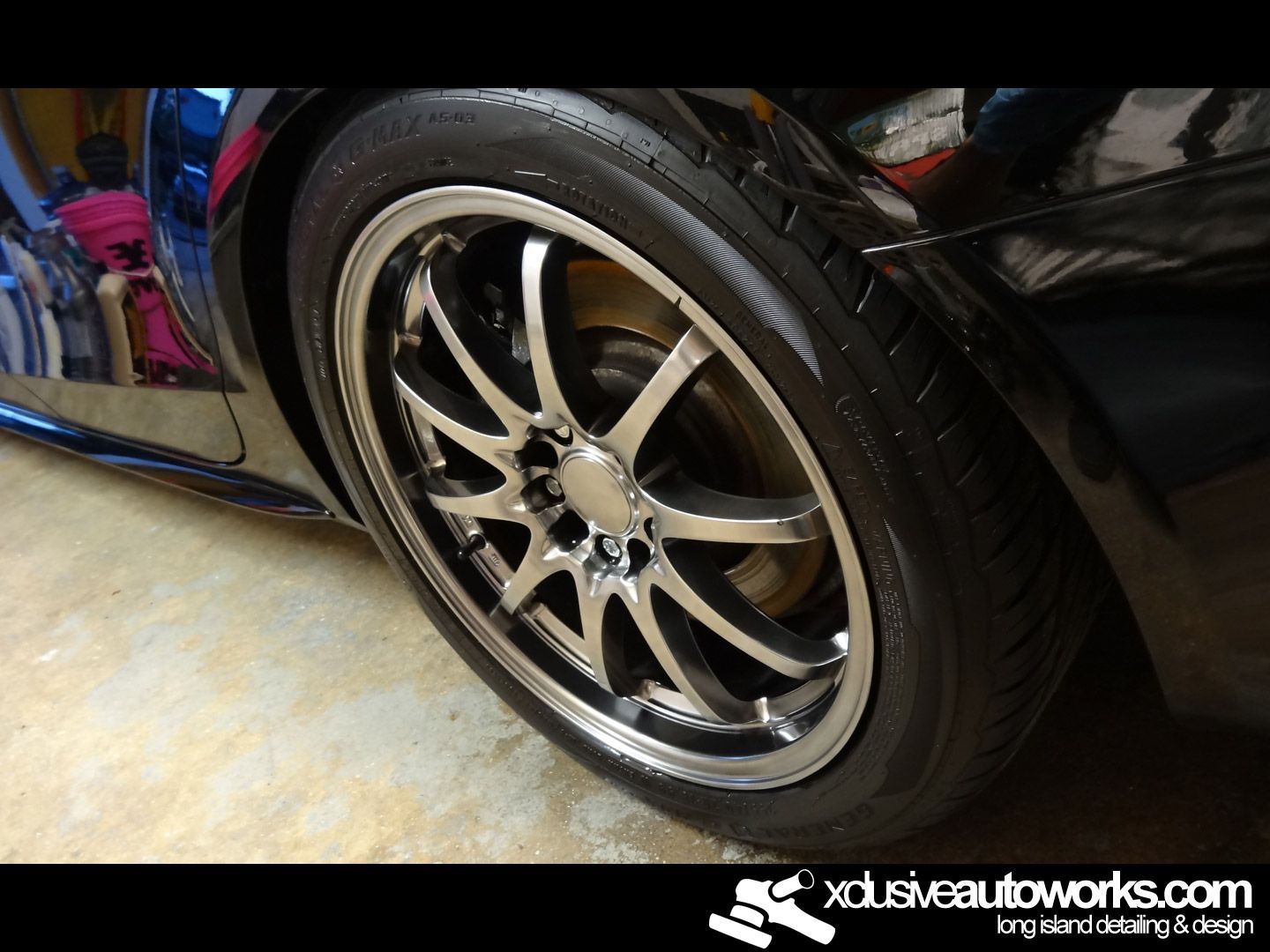 A close up of a car wheel with xdusveautoworks.com written on the bottom