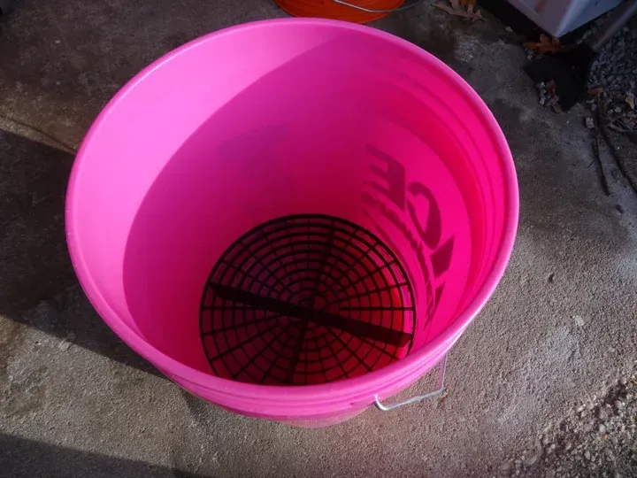 A pink bucket with the number 32 on it
