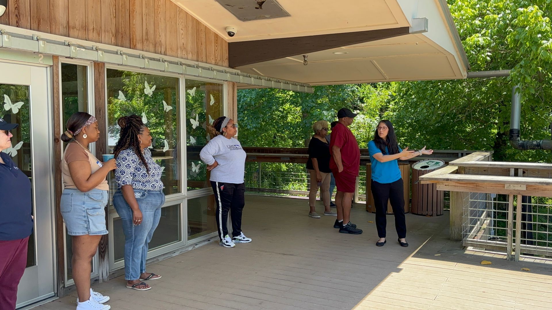 A group of people are standing outside of a building.