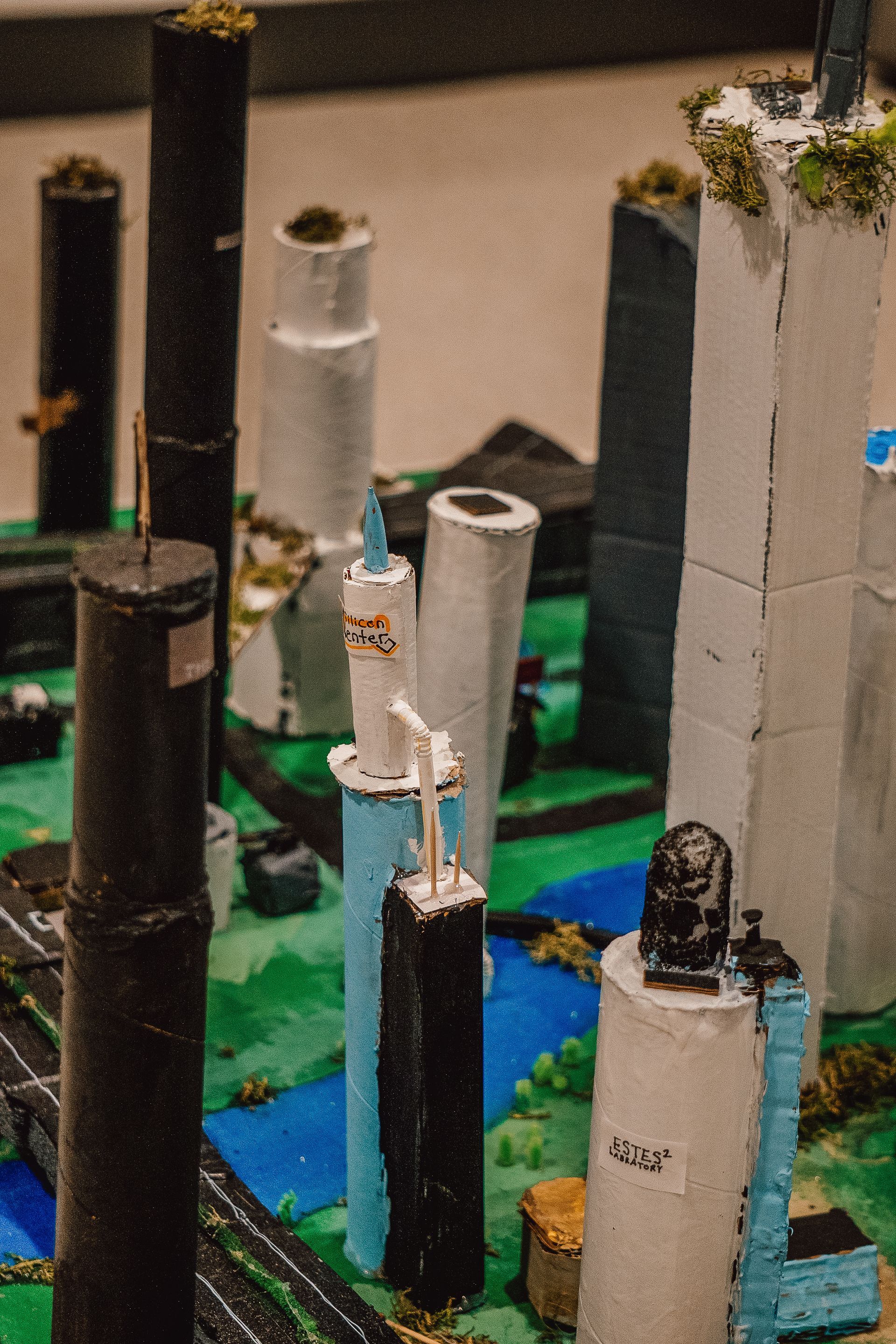 A model of a city made out of toilet paper rolls
