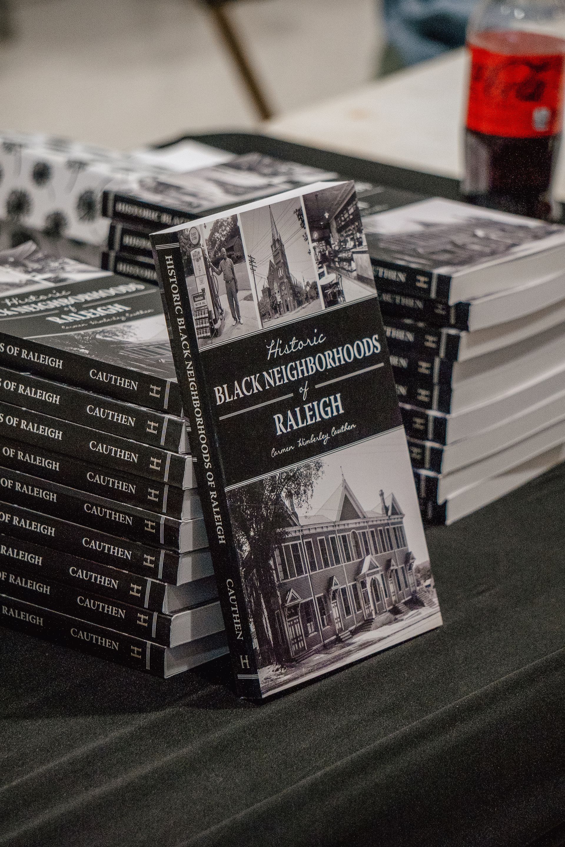 A stack of books sitting on top of each other on a table.